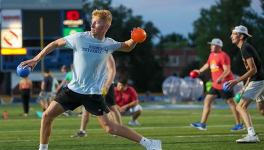 Students on the football field during a campus recreation event 